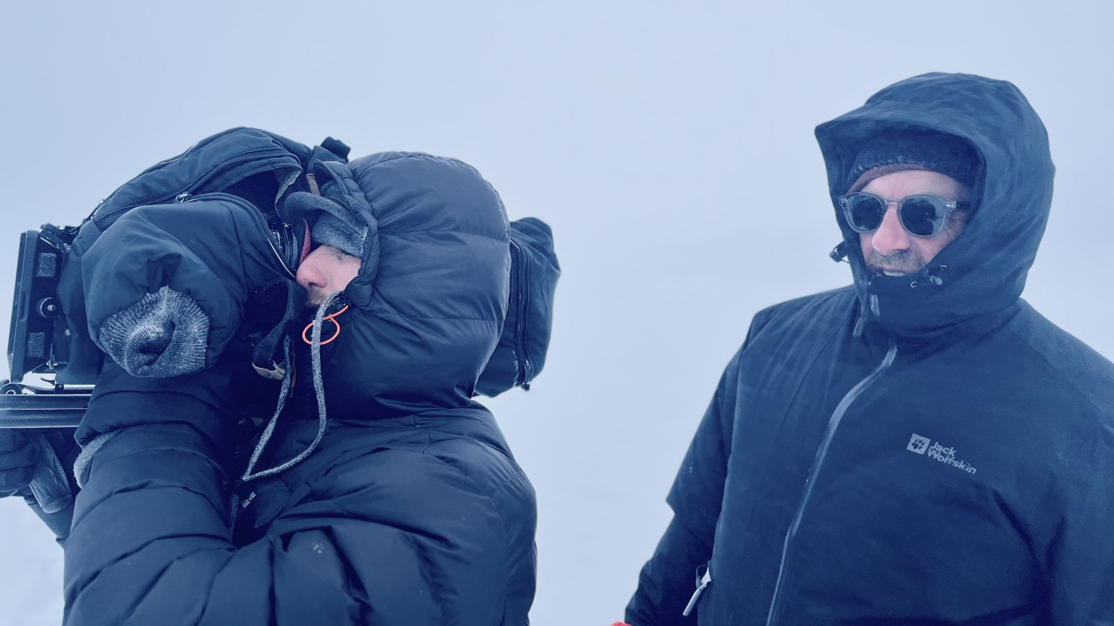 two people filming in extreme conditions